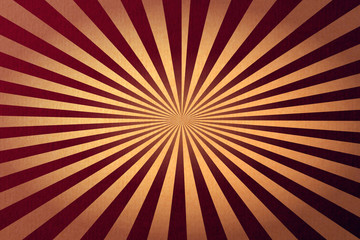 Abstract retro sunburst red background with old paper textured effect.