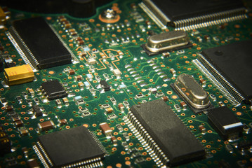 Electronic computer circuit board close up.
