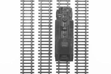 Obraz premium Vintage black model railway isolated on white background. View from above. Selective focus. 