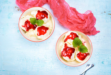 Flat lay of cherry ice cream in two bowls