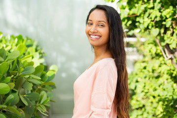 Young beautiful hispanic woman smiling.