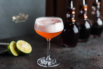 Cocktail of gin, Aperol, lemon juice and egg white