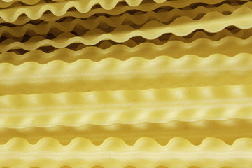 Uncooked spaghetti on table