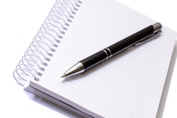 Pen and notepad on white background