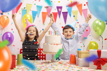 Overjoyed kids celebrating a birthday