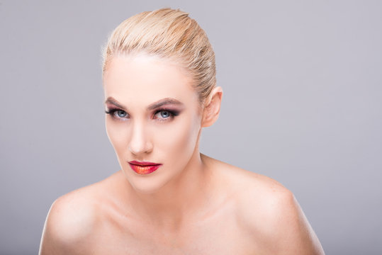 Portrait of sexy young blonde woman wearing make-up.