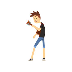Teenager boy playing on guitar. Cartoon character of young artist with stylish haircut in blue shorts and black t-shirt. Guitarist of rock band. Flat vector design
