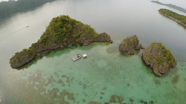 Aerial view of small islands Siete Pecados near in Coron Bay. Palawan. Overcast.