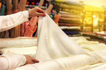Seamstress, tailor with scissors. Cutting. Needles. Cutting process