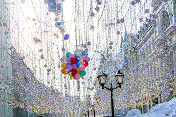 New year decorations in Moscow, garlands and balls, snow.