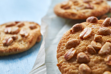 close up cookies with peanuts on the flour