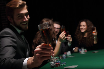 poker player with a glass of wine