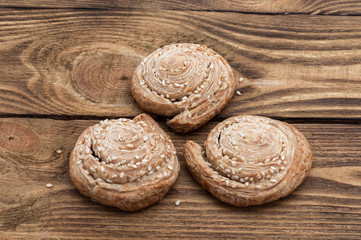 Homemade biscuits with sesame seeds on a wooden table