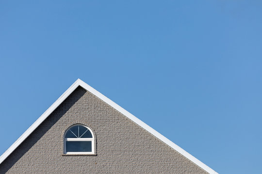 Grey House And Blue Sky Horizontal