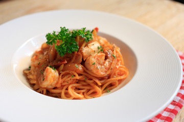 Top view SpaghettiMarinara  on wooden background.