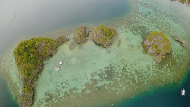 Aerial view of small islands Siete Pecados near in Coron Bay. Palawan. Overcast