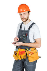 The man builder records something in the phone. Repair and construction. Isolated over white background.