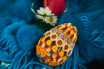 Easter egg on a blue-blue wool scarf