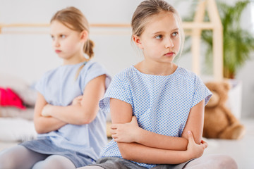 Young offended girl and sister