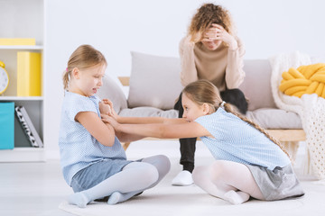 Twin girls arguing