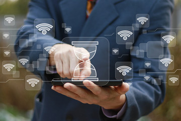 Businessman presses button time clock service wifi network wi fi on virtual digital electronic user...