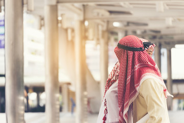 Arab mans greeting at outside with traditional action. Arab concepts.