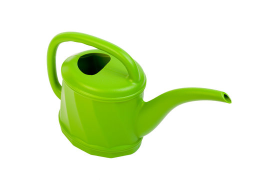 Plastic green watering can on white.