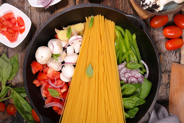 spaghetti and vegetable in pan