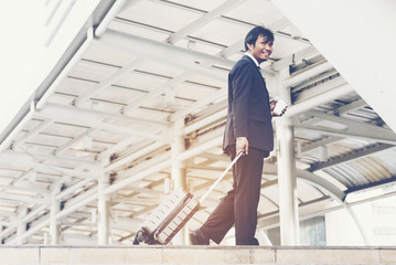 Fototapeta premium Businessman walking in a city. Business concept.