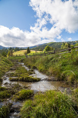 Fototapeta na wymiar forest mountains village fence stream 