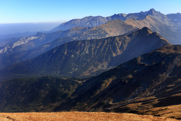 Fototapeta premium Poland, Tatra Mountains, Zakopane - Pass under Kopa Kondracka, Kasprowy Wierch and Swinica peaks with High Tatra mountain range panorama in background