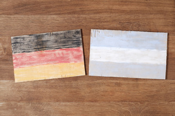 Germany and Argentina flag, concept cooperation friendship on wood background.
