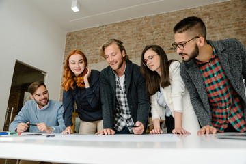 Group of young architects in the design bureau