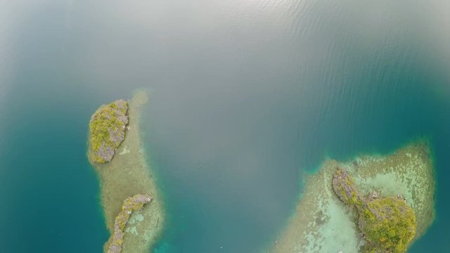 Aerial view of small islands Siete Pecados near in Coron Bay. Palawan. Overcast.