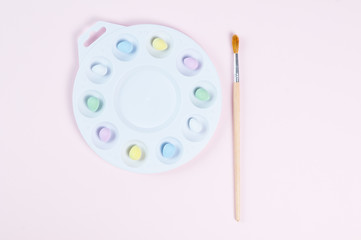 Fototapeta na wymiar pastel easter eggs in a paint palette