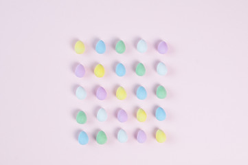 pastel easter eggs on a pink background