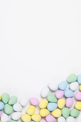 pastel easter eggs on a white background with lots of copy space