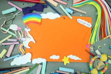 A blank leaf with a picture of a unicorn, a rainbow and clouds. children's postcard