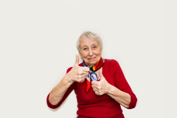 Smiling senior lady gesturing perfect sign
