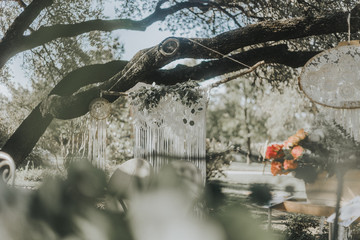 Naklejka premium Macrame hanging on Tree at Garden Party 
