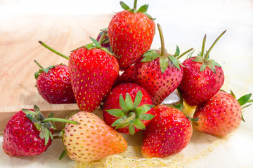 Close up of fresh strawberry in wooden dish