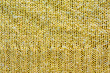 Texture of Yellow Knitted Sweater with Two Types of Knitting. Knit texture as background.