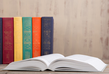 Education and reading concept - group of colorful books on the wooden table