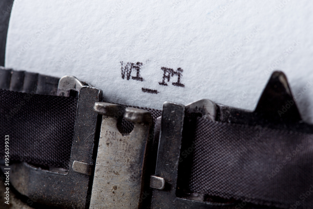 Fototapete wifi text message on the typewriter close-up