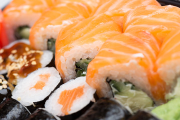 Salmon and caviar rolls served on a plate
