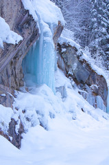 Frozen waterfall with rock