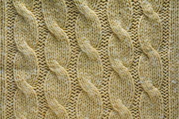 Knit Texture of Beige Wool Knitted Fabric with Cable Knits Pattern. Blank Background