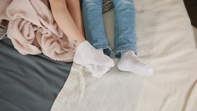 Legs of young attractive couple cuddling and waking up together, family relationships