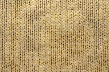 Knit Texture of Beige Wool Knitted Fabric with Regular Pattern. Knit Sweater Blank Background