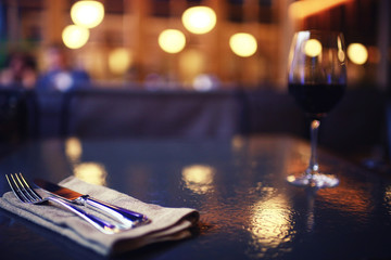 Serving a glass of red wine in a restaurant